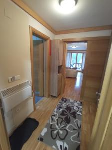a small room with a rug on the floor at Snježna Vila in Jahorina