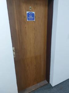 a wooden door with a sign on it at BELE STAZE-Brzece,Kopaonik in Brzeće