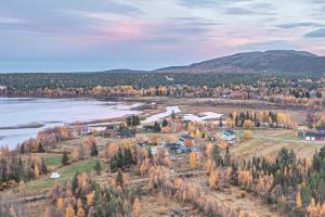 an aerial view of a town next to a lake at Levi Nietos in Kittilä