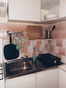 a kitchen with a sink and a counter top at Apartament cu o cameră in Cluj-Napoca