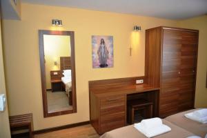 Letto o letti in una camera di Hotel Pax Cordis