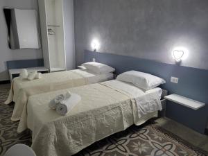 Postel nebo postele na pokoji v ubytování B&B Leon