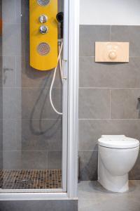 a bathroom with a shower with a toilet in it at New Pescara City b&b in Pescara