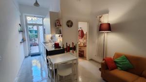 a living room with a couch and a table at Via Arriano 11 in Rome