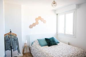 Ένα ή περισσότερα κρεβάτια σε δωμάτιο στο Appartement en bord de mer avec vue exceptionnelle