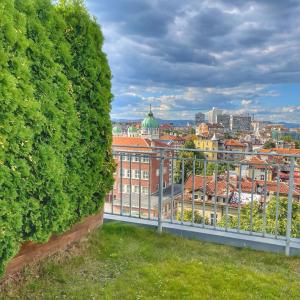 a view of the city from the roof of a building at ATRIUM Boutique Suites Sofia in Sofia +63 photos