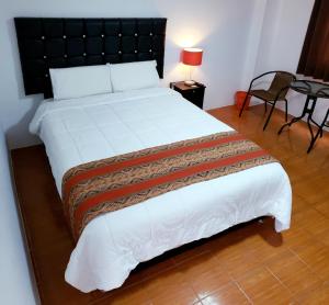 Letto o letti in una camera di Hostal Cusco de mis Sueños