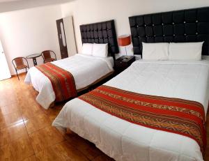 Letto o letti in una camera di Hostal Cusco de mis Sueños