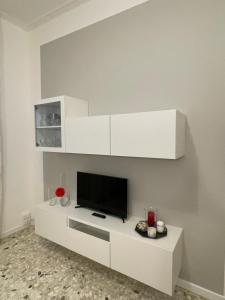 Televízia a/alebo spoločenská miestnosť v ubytovaní Casa Lia 47