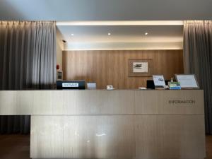 a reception desk in a hotel room with a reception counter at Sodo Hotel in Paju