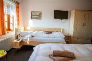 Posteľ alebo postele v izbe v ubytovaní Horský hotel Paprsek