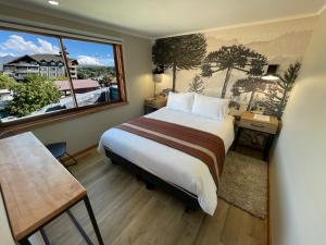 Postel nebo postele na pokoji v ubytování Mawün Hotel Pucón