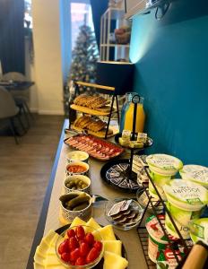 a long table with different types of food on it at Bed & Breakfast Donji Grad in Zagreb