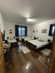 Rúm í herbergi á Apartman Gakić 1