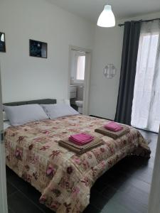 Ein Bett oder Betten in einem Zimmer der Unterkunft Affittacamere Casa Marconi
