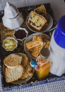 a tray with plates of food on a table at Espacio Infinito in Capilla del Monte