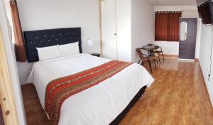 Letto o letti in una camera di Hostal Cusco de mis Sueños