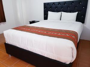Letto o letti in una camera di Hostal Cusco de mis Sueños