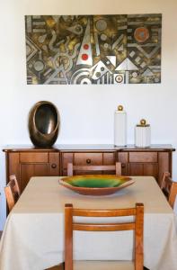 a dining room table with a bowl on top of it at Beach House Haller in Aljezur