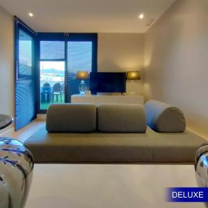 a large bed in a room with a window at Mediterranean Barcelona Apartments in Barcelona