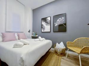 A bed or beds in a room at La Latina Market - Apartamento de 2 dormitorios