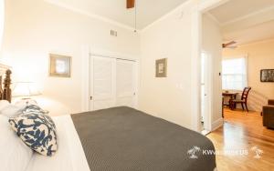 a bedroom with a bed and a dining room at The Island Suite at KW Vacation in Key West