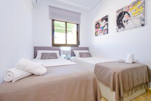 Posteľ alebo postele v izbe v ubytovaní Holiday Penthouse San Miguel 5-7