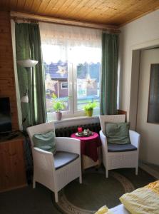 a room with a table and chairs and a window at Haus Fessel - Helenenruh in Elend