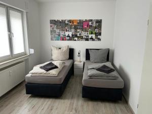 מיטה או מיטות בחדר ב-Eine Wohnung zum wohlfühlen