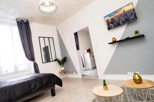 Posteľ alebo postele v izbe v ubytovaní LD-Location Hôtel