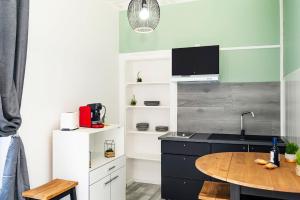 Kuchyňa alebo kuchynka v ubytovaní LD-Location Hôtel