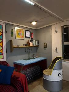 a living room with a sink and a bath tub at Secret Woodland Hideaway for two in Ilfracombe