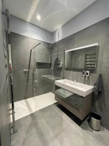 a bathroom with a sink and a shower at Laurieston Inn in Falkirk +47 photos