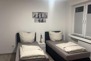 Posezení v ubytování Eine modern renovierte Wohnung mit Balkonterrasse.