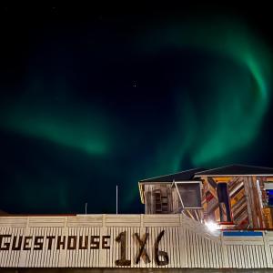 an image of the northern lights in the sky at Guesthouse 1x6 in Keflavík
