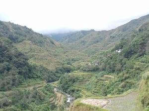 a view of a valley in the mountains at Cambulo Am-way Tavern in Banaue