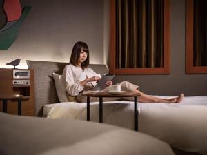 Postel nebo postele na pokoji v ubytování Hotel JAL City Haneda Tokyo