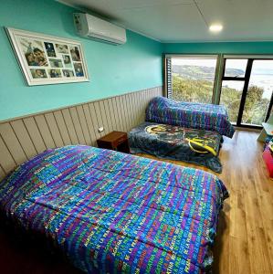 En eller flere senge i et værelse på Bella casa de campo con panorámica vista al mar