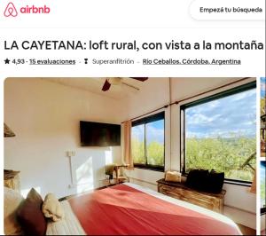 a bedroom with a bed and a large window at LOFT LA CAYETANA, Grupo Cabaña La Triada in Río Ceballos