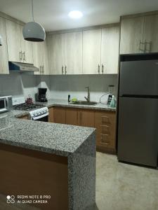 A kitchen or kitchenette at Apartamento Inglaterra