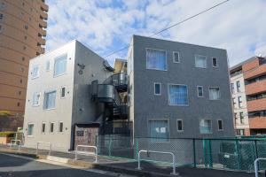 a building with a spiral staircase on the side of it at Space Roppongi in Tokyo