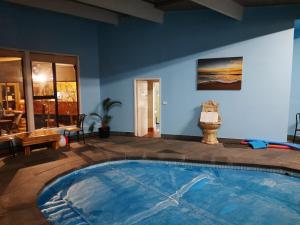 a large swimming pool in the middle of a room at Abbotswood Motor Inn in Geelong