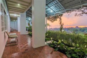 a hallway with a mural of a sunset at RedDoorz At Jalan Raya Lembang in Bandung