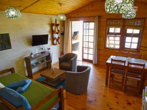 a living room with a couch and a table at Un Sueño 2 in Punta Del Diablo