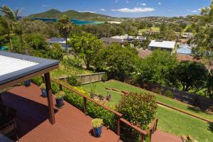 a balcony with a view of a yard at Marine Drive in Forster