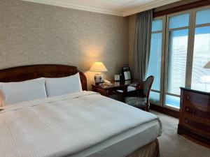 Voodi või voodid majutusasutuse Evergreen Laurel Hotel Taipei toas