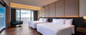 PARKROYAL Langkawi Resort客房内的一张或多张床位
