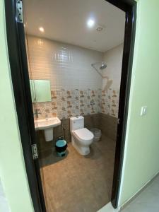 a bathroom with a toilet and a sink at Munnar BnB in Munnar