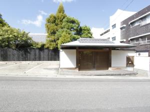 a building on the side of a street at Kappo Ryokan Yumesaki in Beppu