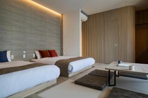 Cama ou camas em um quarto em fav HIROSHIMA HEIWAODORI
